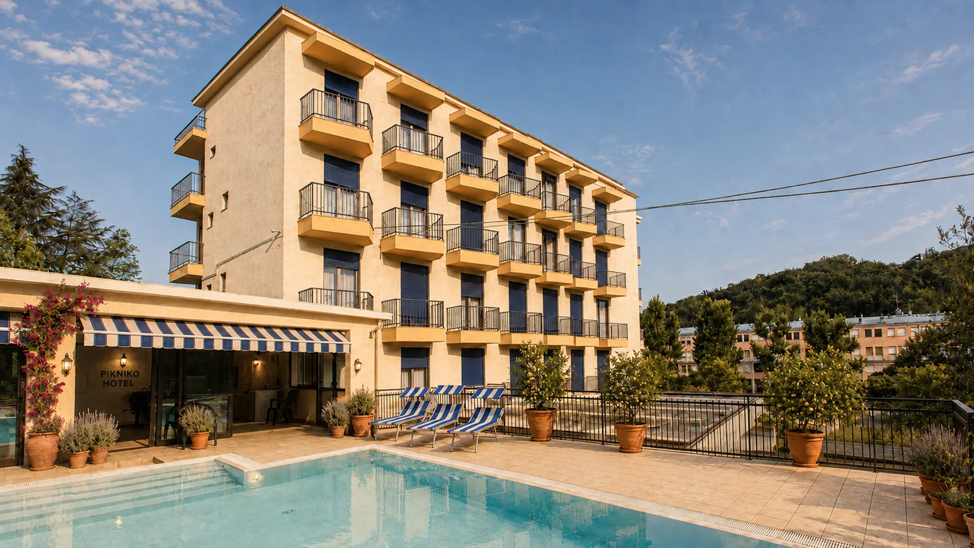 Outdoor pool and terrace at Pikniko Tabiano Centre